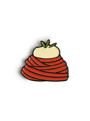 A metal enamel pin of a mound of tomato pasta with burrata on top of the pasta. 